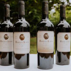 an image of four bottles of wine, RoxyAnn Winery's signature series for summer of 2022.