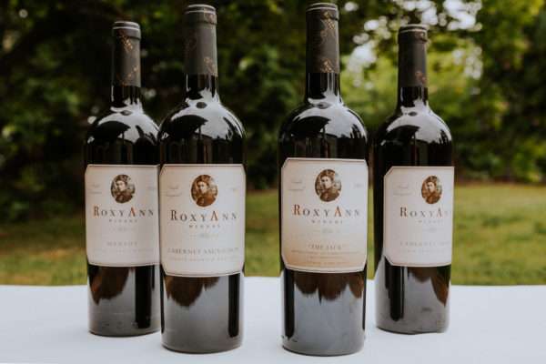 an image of four bottles of wine, RoxyAnn Winery's signature series for summer of 2022.