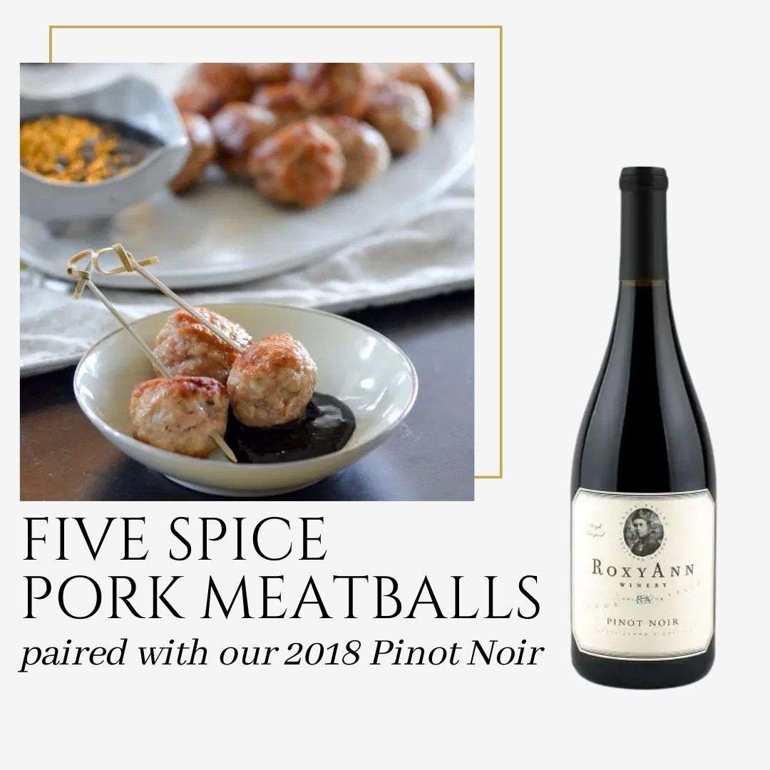The image depicts a bowl of three pork meatballs and also shows a bottle of RoxyAnn 2018 Pinot Noir. The caption on the graphic says "Five Spice Pork Meatballs paired with our 2018 Pinot Noir." 