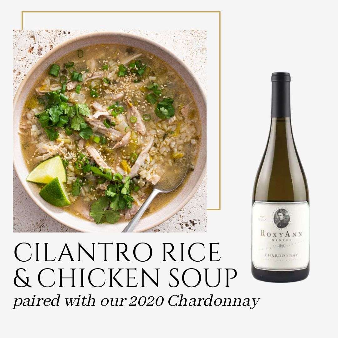An image from Quick & Healthy Recipes And Their Wine Pairings by RoxyAnn Winery. The image depicts a bowl of chicken and wild rice soup topped with cilantro and limes and also shows a bottle of RoxyAnn 2020 Chardonnay. The caption on the graphic says "Cilantro Rice & Chicken Soup paired with our 2020 Chardonnay." 