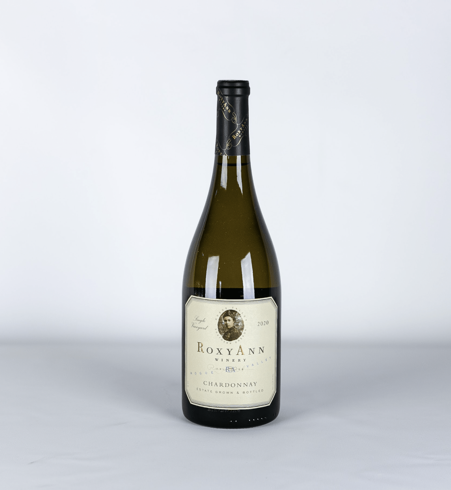 An image of the RoxyAnn Winery Chardonnay. With its notes of lively green apple, creamy texture, and subtle oak finish this wine makes a perfect fall-flavored ingredient to add to any fall wine cocktail mixture.